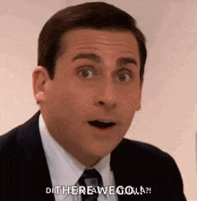 a man in a suit and tie is making a surprised face and saying `` di there a we go ? ''