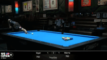 a pool table that says us open on the bottom