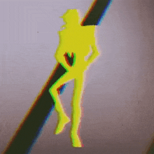a yellow silhouette of a person standing on a pole .