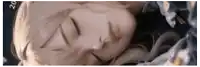 a close up of a woman 's face with her eyes closed and the number 20 in the corner