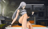 a woman with long white hair is sitting on a bed with her legs crossed .