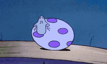 a cartoon character is sitting inside of a purple and blue egg