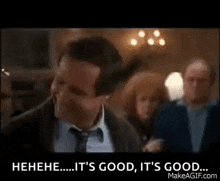 a man in a suit and tie is laughing and saying `` it 's good , it 's good ... '' .