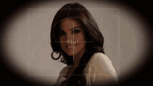 a woman is being targeted by a crosshair on her face