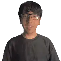 a man wearing glasses and a devin shirt