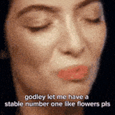 a close up of a woman 's face with the words godley let me have a stable number one like flowers pls .