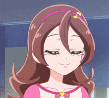 a girl with brown hair and a pink headband