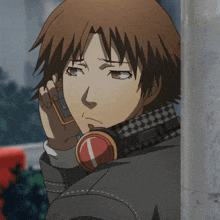a man wearing headphones and a watch talks on a phone