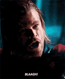 a close up of a man with his mouth open and the words blaagh written below him