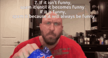 a man in a red shirt is holding a bag of potato chips