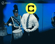 a man in a marching band with a yellow c on his face