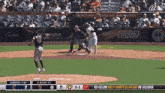 a baseball game is being played in a stadium sponsored by motorola and state farm