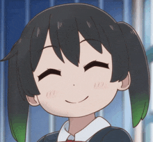 a close up of a girl 's face with her eyes closed and a smile on her face