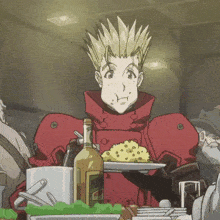 a man in a red jacket is holding a plate of food and a bottle of french fries