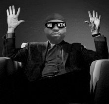 a man with a beard is wearing sunglasses that say m8 win