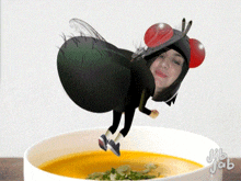 a woman in a fly costume is in a bowl of soup with jib jab written on it