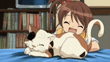a girl laying on a bed with a cat and a sony tv behind her