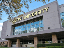 the front of a building that says goon university on it
