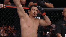 a fighter in a cage with the word mma on the shirt