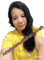 a woman wearing a yellow shirt with the words assalamualaikum wrwb on it