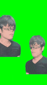 a man wearing a mask is standing next to another man on a green screen .