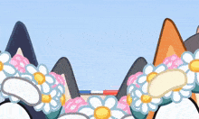 a cat 's ears are decorated with flowers and a blue sky in the background .
