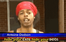 a man wearing a red bandana is talking about hiding your cats and dogs