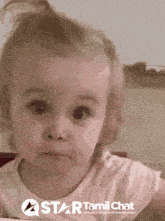 a little girl with a star tamil chat logo in the corner