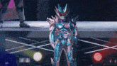 a man in a superhero costume stands on a stage with a red light behind him