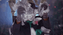 a man in a joker costume holds a pile of money in his hands