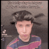 a young man is wearing a striped shirt and has a goofy side shine through hairstyle .