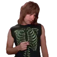 a man wearing a skeleton shirt holds a cigarette in his hand