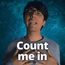 a man wearing glasses and a gray shirt says count me in