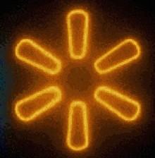 a neon sign that looks like a star with a dark background