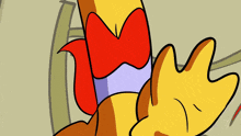 a close up of a cartoon character with a red bow on his head
