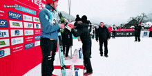 a podium with sponsors such as hylo on it