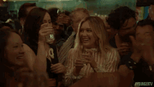Cheers GIF - Hilary Duff Kelsey Peters Younger Tv GIFs