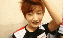 a person with red hair is wearing a shirt that says lebom