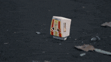 a toy with the word metro on it is on the ground