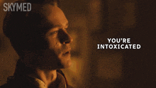 a man with the words you 're intoxicated written below him
