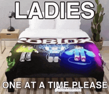a bed with a blanket that says ladies one at a time please on it