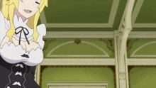 a girl with blonde hair and a mustache is in a room with green walls