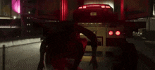 a car is driving down a highway at night