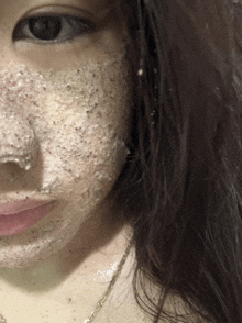 a close up of a woman 's face with a face mask on it