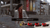 a man in a suit is playing a video game .