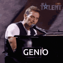 a man is singing into a microphone while playing a piano and the word genio is on the bottom