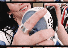 a close up of a person holding a can that says cd