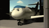 a cartoon airplane with a smiling face is in a hangar