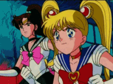 a couple of anime girls standing next to each other with one wearing a pink bow