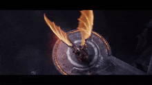 a dragon is flying through the air with fire coming out of it 's wings